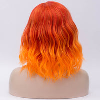 Orange mix with red medium length curly wig Shiny Way Wigs Perth WA