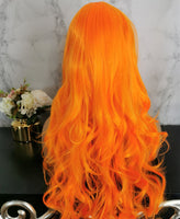 Bright orange long curly costume wig by Shiny Way Wigs Melbourne VIC