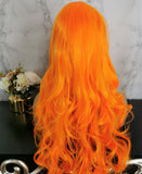 Bright orange long curly costume wig by Shiny Way Wigs Melbourne VIC